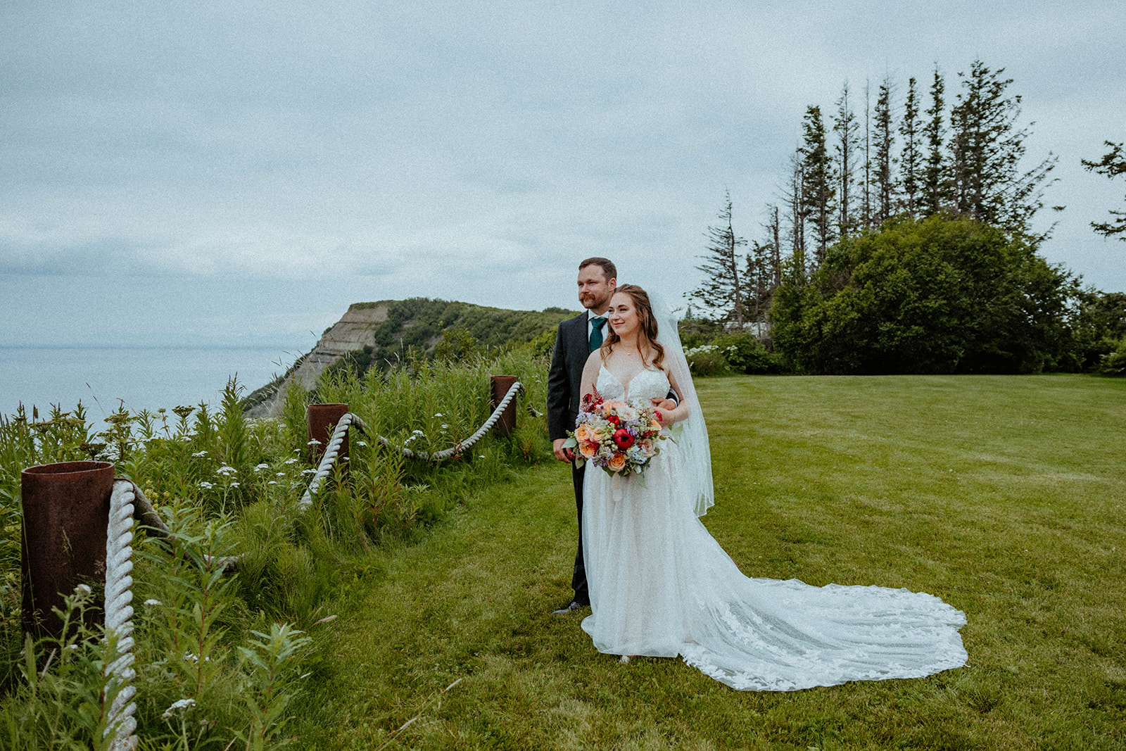 A Bride and Groom look out at the view.